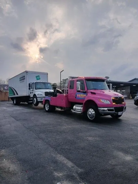 Car Wars Towing fleet — pink wrecker and white flatbed at Orange TX lot